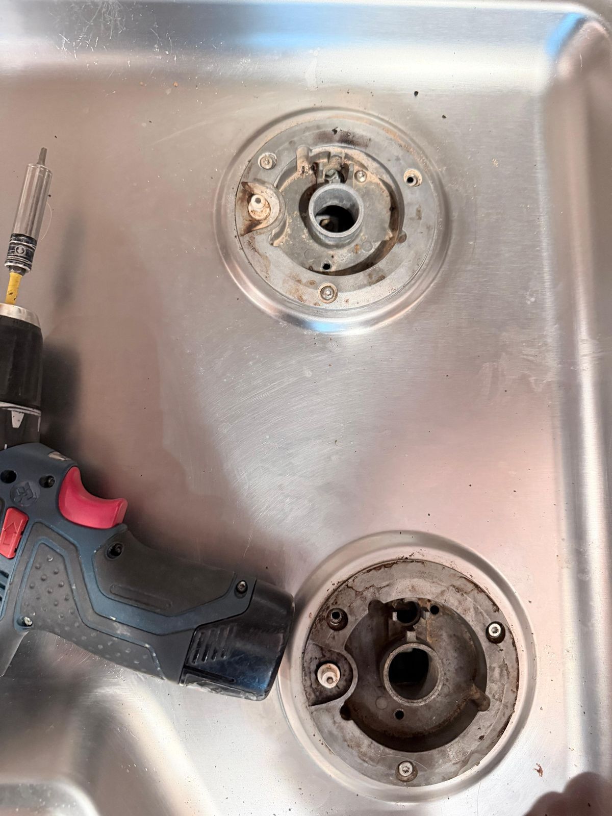 Gas cooktop burner bases removed for repair