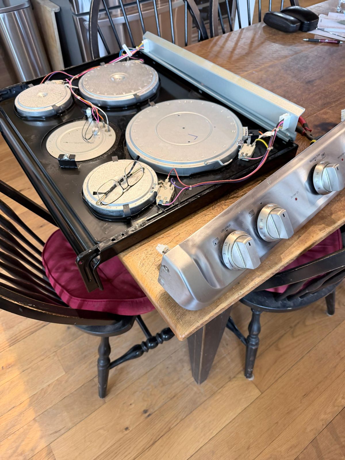 Electric cooktop opened up for element and wiring repair