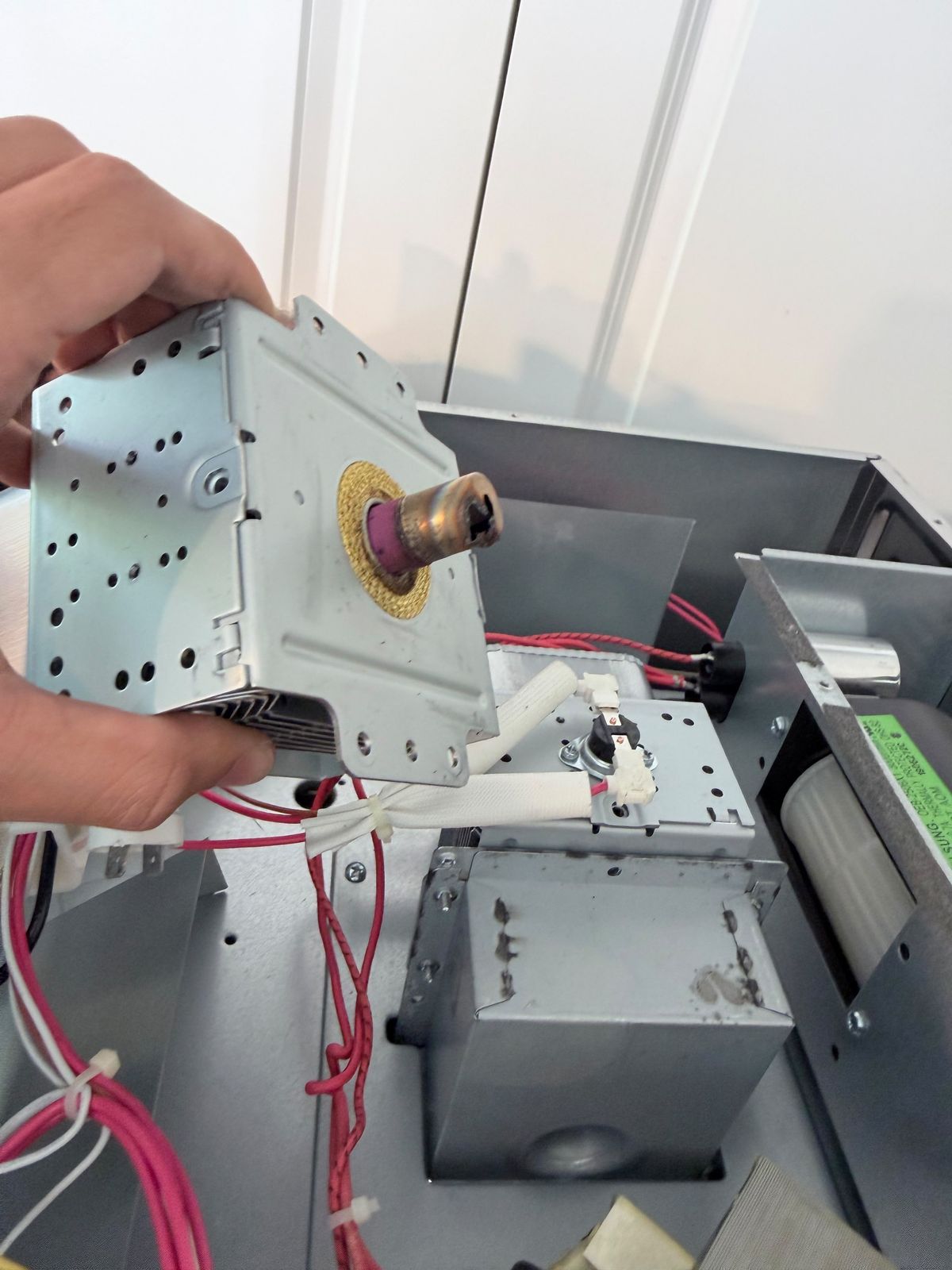 Microwave magnetron removed for replacement