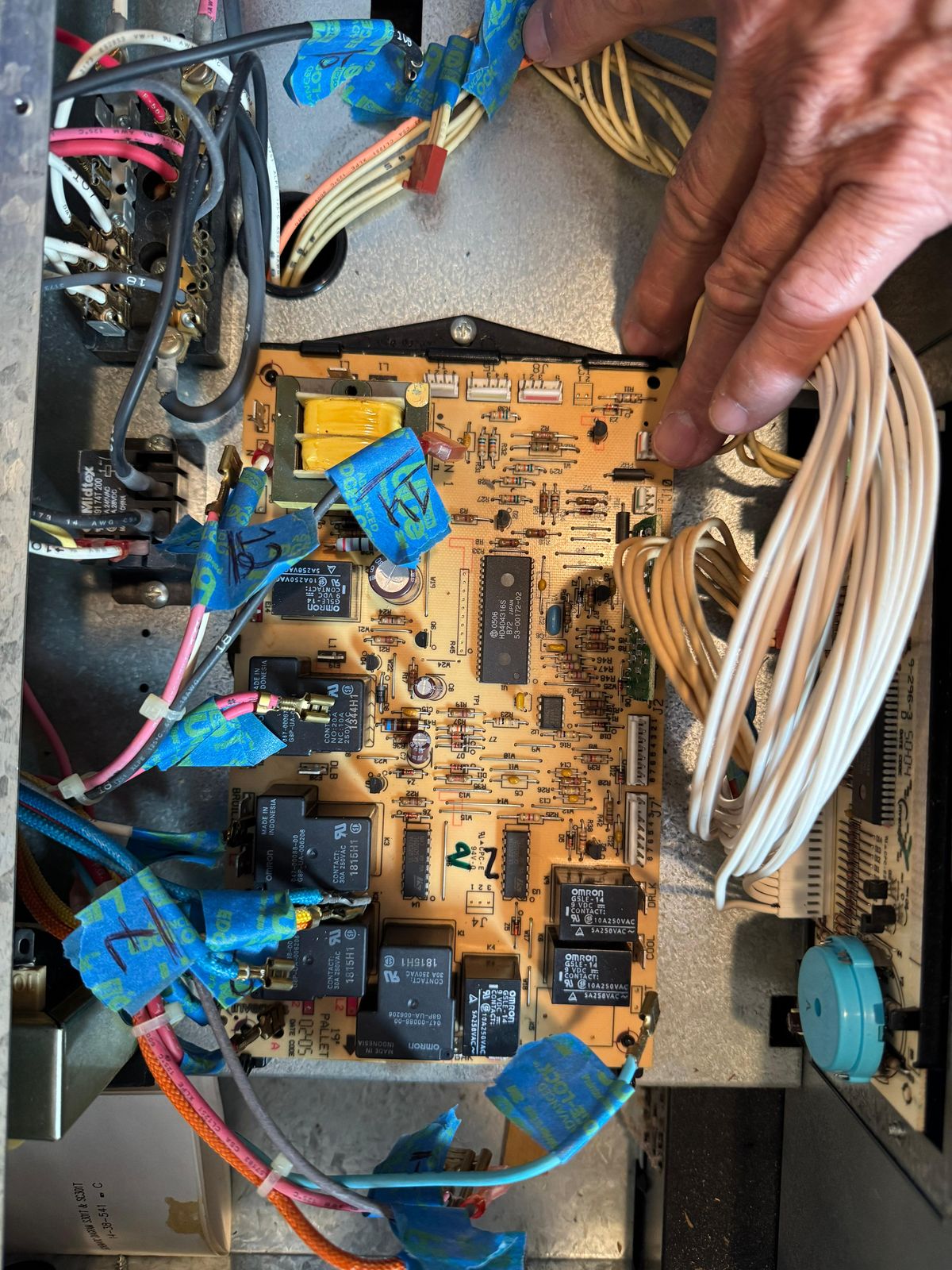 Technician working on an oven control board