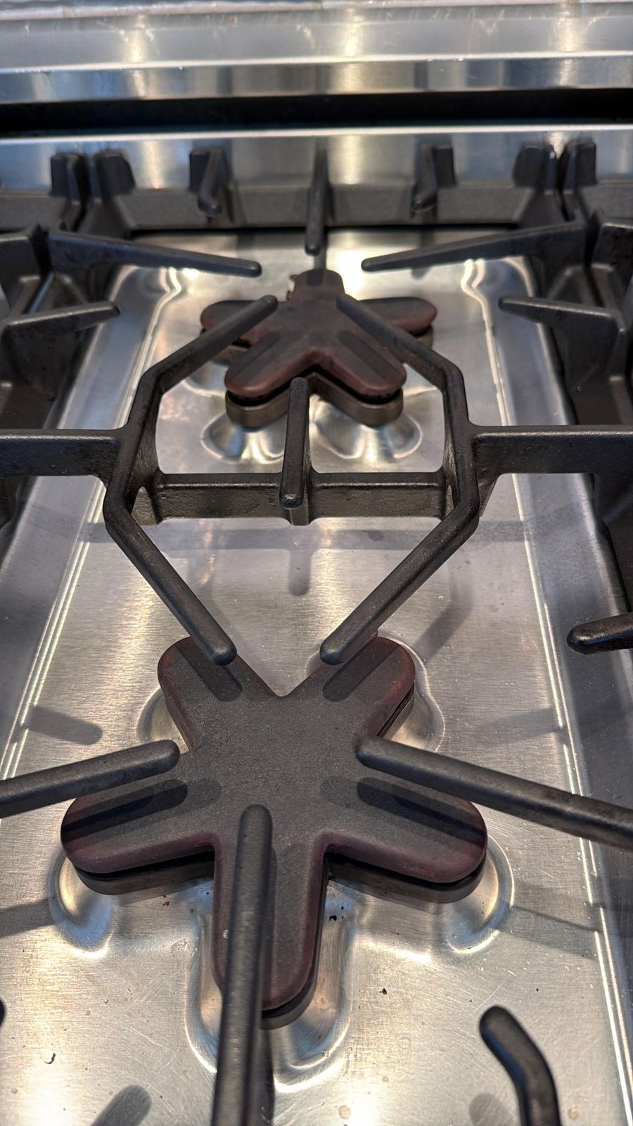 Thermador Star burner grates on a gas cooktop